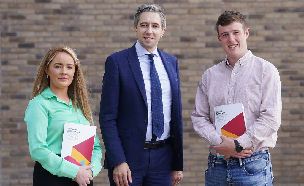 Left to Right - Megan Berry, Simon Harris, and EPIC Youth Council member Rory Brown at the launch of the National Access Plan. Rory and Megan are holding the publication.