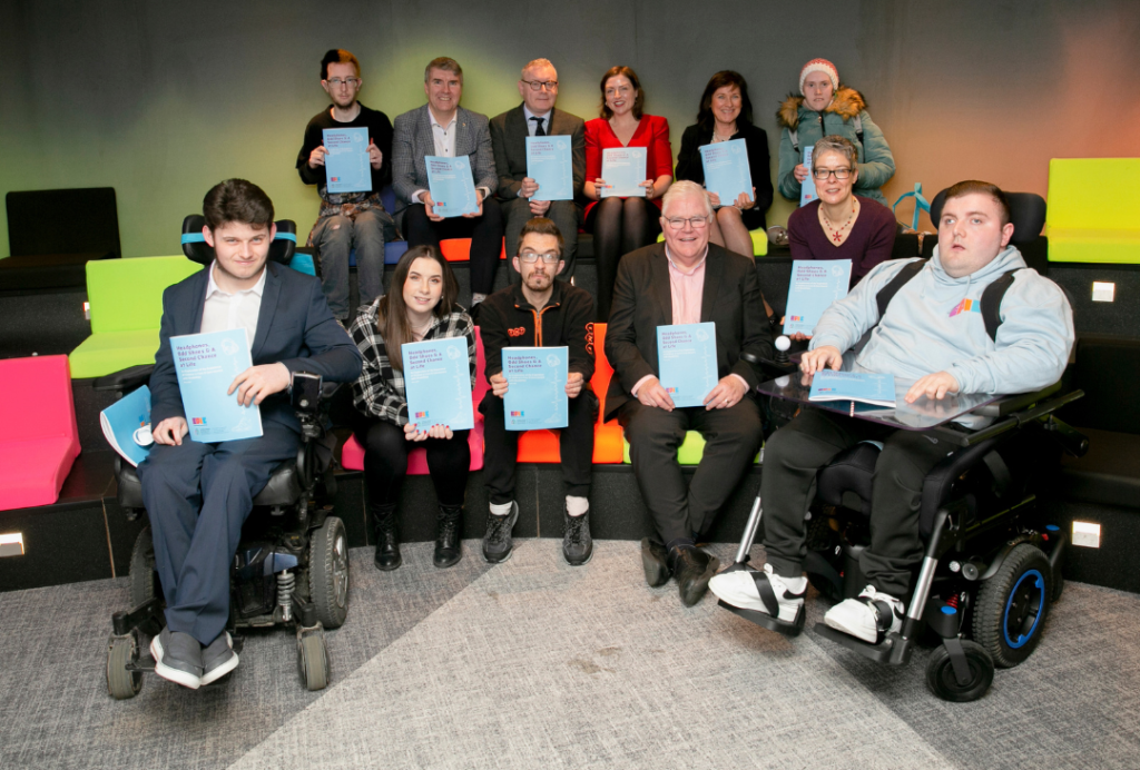 Group of people posing with our 'Headphones' report at the launch. 