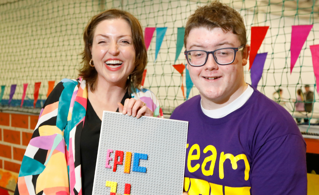 EPIC CEO, Marissa Ryan, with EPIC Youth Council member, Cian, holding an EPIC Lego board.