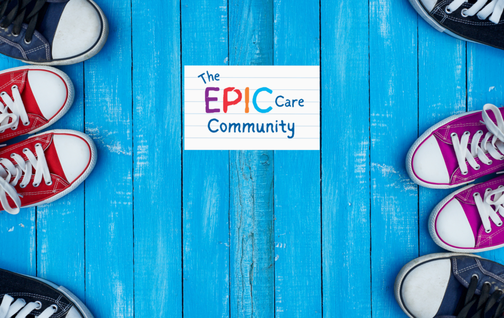 The EPIC Care Community logo on blue wooden decking with running shoes lined up to the left and right of the logo.